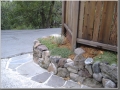 Edge of driveway after: using stone for steps and retaining wall.