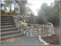 Lower landing with steps and retaining wall