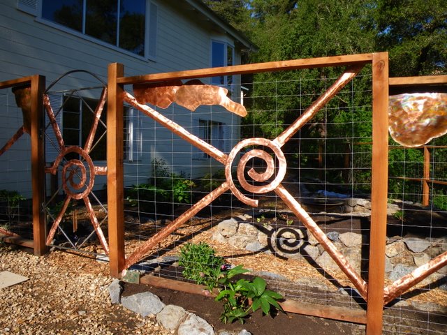 Deer fence with copper sculpture