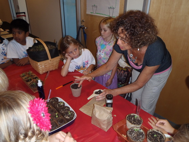 Children learning to sow seed