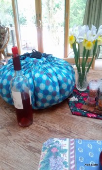 The Wonderbag and wine and flowers, ready for dinner